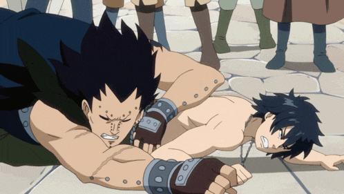a man is laying on the ground while another man is laying on the ground