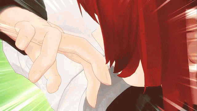 a person with red hair is holding another person 's finger
