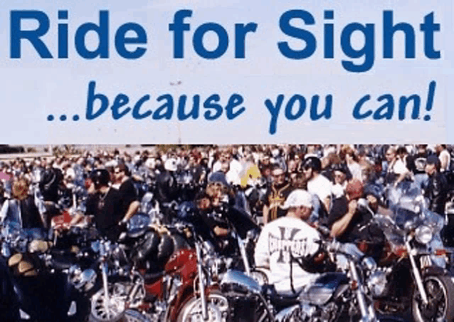 a crowd of people riding motorcycles under a sign that says ride for sight