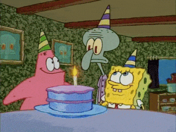 spongebob and patrick are celebrating a birthday with a cake