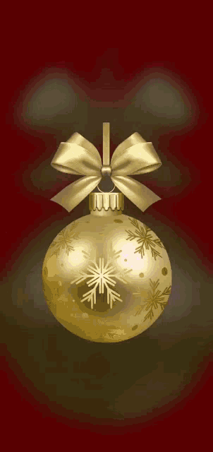a gold christmas ornament with the name nadelia written on the top