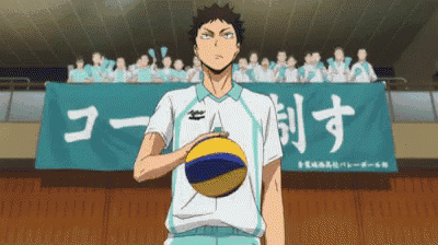 a man holding a volleyball in front of a banner that says ' a ' on it