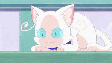 a white cat with blue eyes is laying down on a green surface