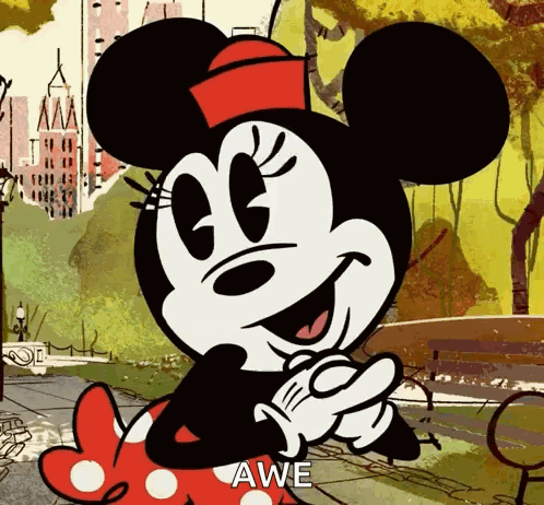 a cartoon of minnie mouse wearing a red and white polka dot dress says awe