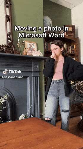 a woman standing in front of a fireplace with the caption moving a photo in microsoft word on it