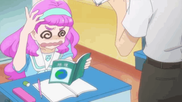 a girl with pink hair is sitting at a desk reading a book in a foreign language