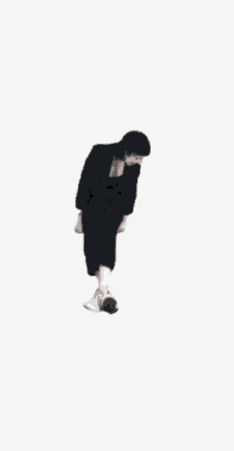 a woman in a black suit and white socks is floating in the air