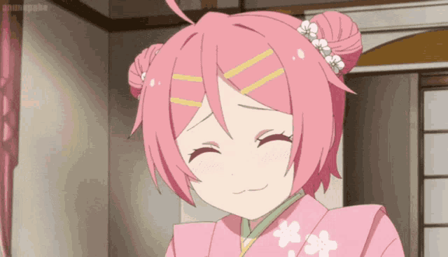 a girl with pink hair is wearing a kimono and smiling