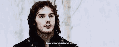 a man with long hair is saying love always betrays us