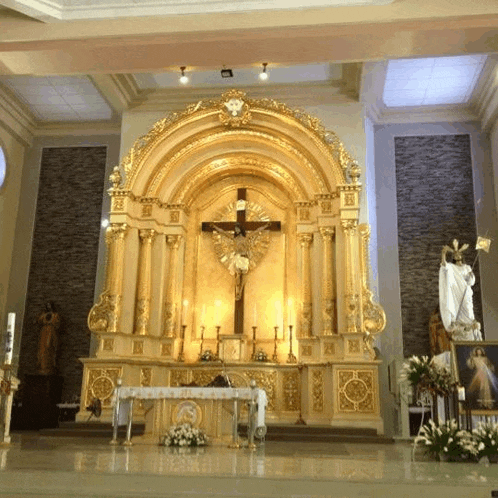 a church with a large altar with a cross on it