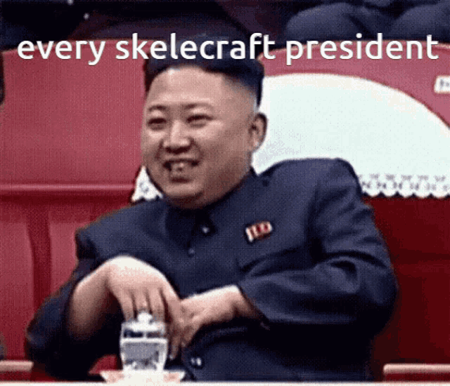 a man in a suit is sitting in a stadium with the words every skeletcraft president written above him .