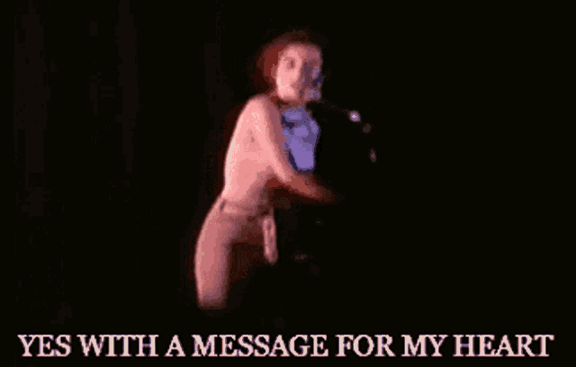 a naked woman singing into a microphone with the words " yes with a message for my heart " below her