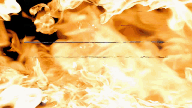a close up of a fire with a black background and a blue line in the middle