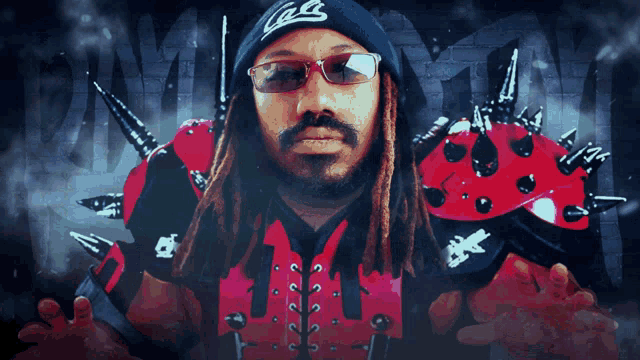 a man with dreadlocks wearing sunglasses and a black hat with the letter g on it