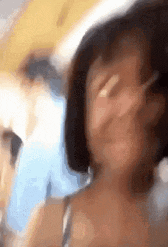 a close up of a person 's face with a blurred background
