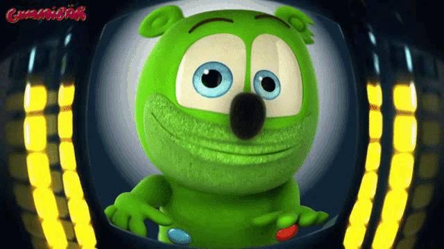 a green gummy bear with blue eyes and the word gummibär on the bottom left