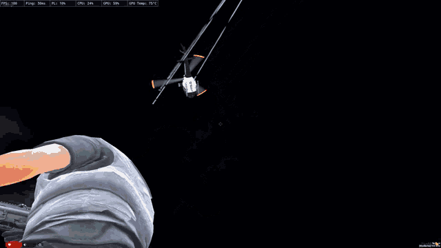 a computer screen shows a man looking at a helicopter flying in the dark