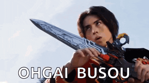a man is holding a sword in his hand with the words `` ohgai busou '' written on the bottom .