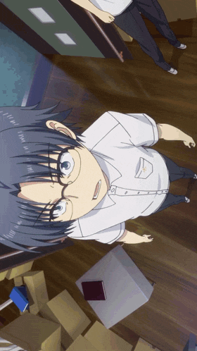 a boy with glasses is standing in a room surrounded by cardboard boxes