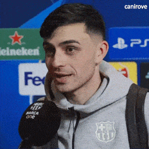 a man wearing a grey sweatshirt with a fcb logo on it