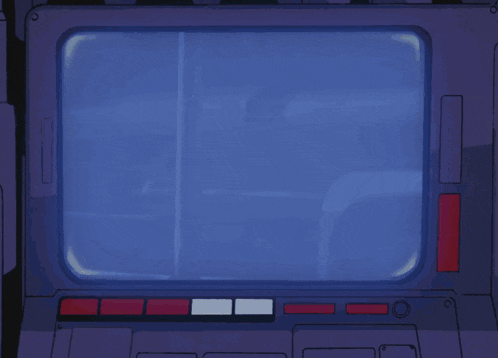 a hand is pressing a button in front of a computer screen