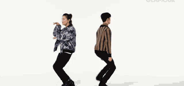 a man and a woman are dancing in front of a white background that says glamour on it