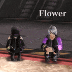 a couple of people sitting next to each other in a room with the word flower on the bottom .