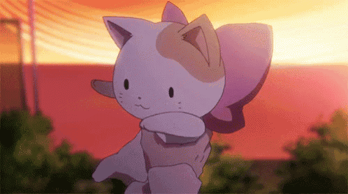 a cartoon cat is being held in someone 's arms in front of a sunset .