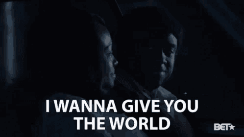 a man and a woman in a car with the words i wanna give you the world above them