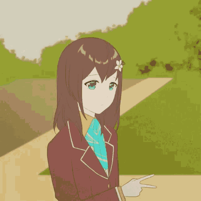 a girl in a suit and tie is pointing at something .