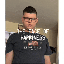 a young man wearing glasses and a blue shirt that says the face of happiness