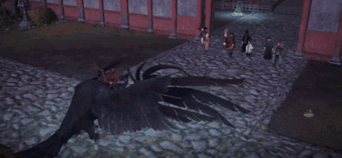a group of people are standing on a cobblestone street in front of a building with a dragon in the background