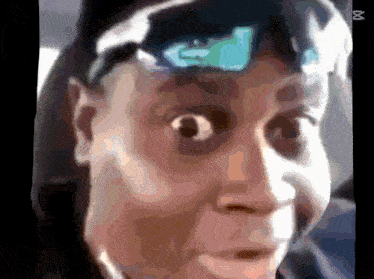 a close up of a person 's face with an x on the bottom left