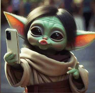 a baby yoda doll is taking a selfie with her phone .