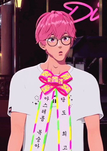 a boy with pink hair is wearing glasses and a ribbon around his neck with korean writing on it