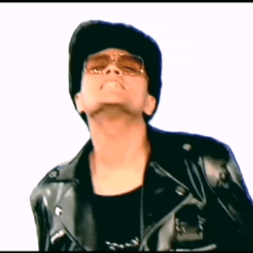 a man wearing sunglasses and a leather jacket
