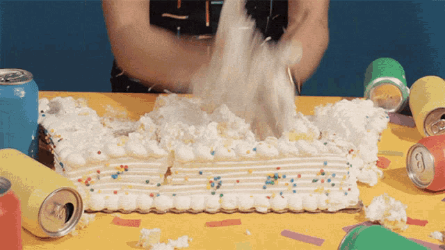 a person is smashing a cake with a hammer
