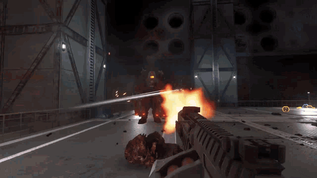 a person is holding a gun in a video game with a fireball coming out of it