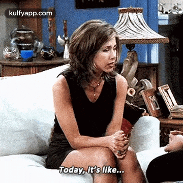 a woman is sitting on a couch talking to a man and saying `` today , it 's like ... ''