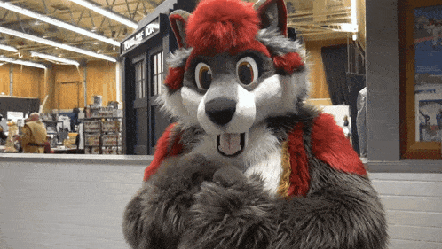 a furry wolf costume is standing in front of a doctor who sign