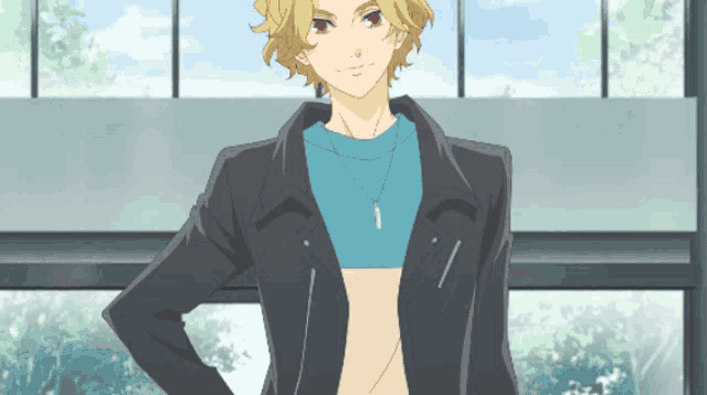 a man with blonde hair and a blue shirt is standing in front of a window
