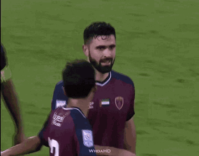 a soccer player with the number 12 on the back of his shirt