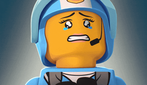 a lego figure with a sad face and a microphone on her head