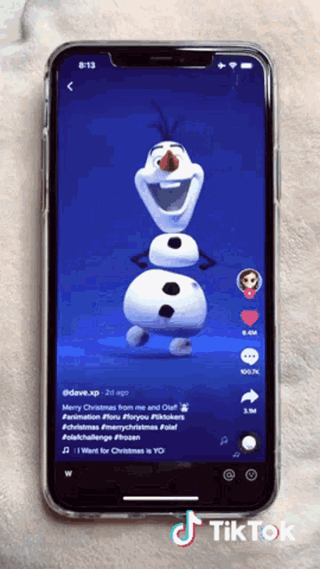 a cell phone displays a tiktok video of olaf