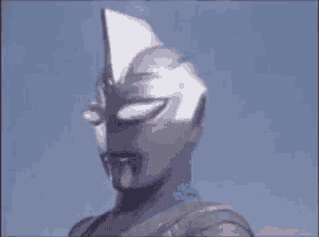 a close up of a superhero 's face with a helmet on .