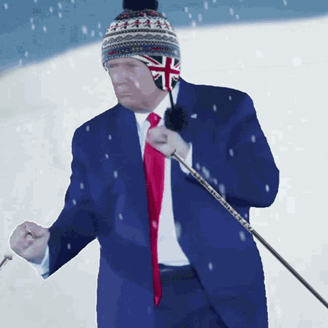 a man in a suit and tie holding a golf club that says ' taylormade ' on it