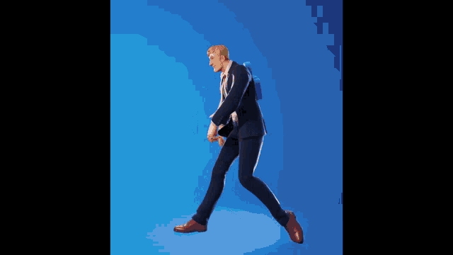 a man in a suit and tie is dancing in front of a blue background .