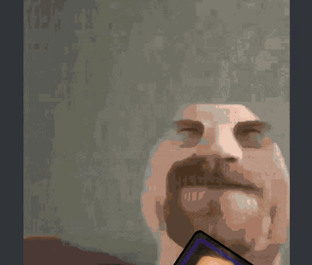 a person is holding a picture of a man with glasses and the words сегодня куплинов on it