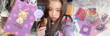 a girl is holding a purple notebook with a cat on it and a lollipop .