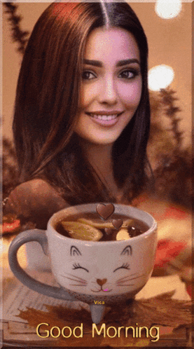 a woman is smiling next to a cup of coffee with the words good morning written on it
